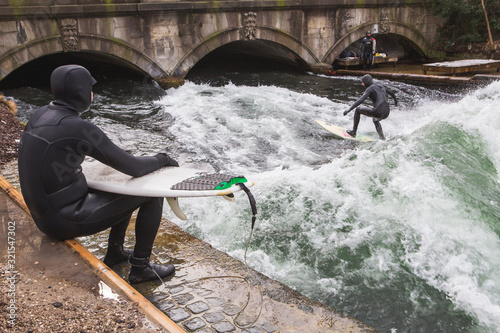 Photography Surfer surfing an artificial wave in Munich city center, Germany