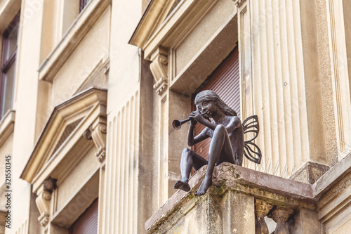 Beautiful statue at the balcony in the council Square the historical center of Brasov.  photo