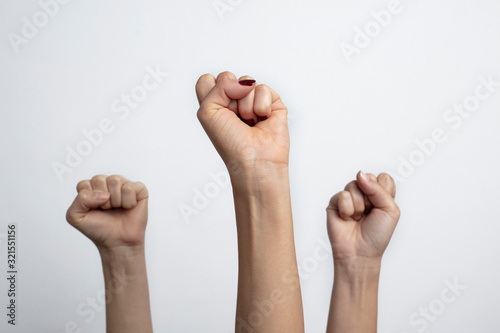 Together we stand ! Many clenched fists punch air energetically