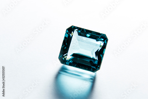 close macro on faceted gem of blue topaz