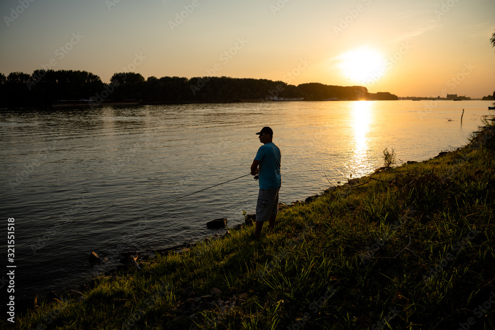 Men fishing on the river