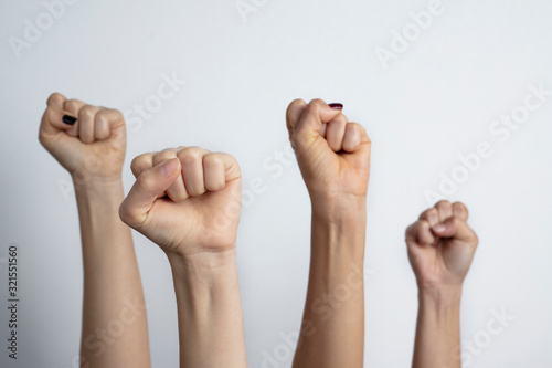 Together we stand ! Many clenched fists punch air energetically