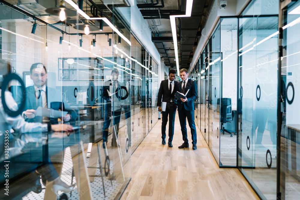 custom made wallpaper toronto digitalMultiracial businessmen having conversation in office corridor