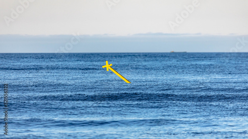 signal buoy against the blue sea