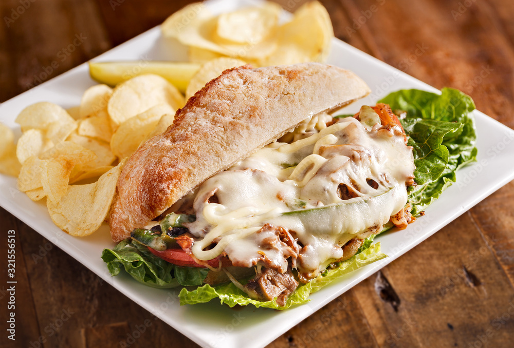 American Philly Steak and Cheese Sandwich with Potato Chips American Philly Steak and Cheese Sandwich with Potato Chips