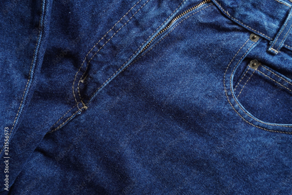 Naklejka premium Jeans background. Denim jeans texture. Blue denim pattern.