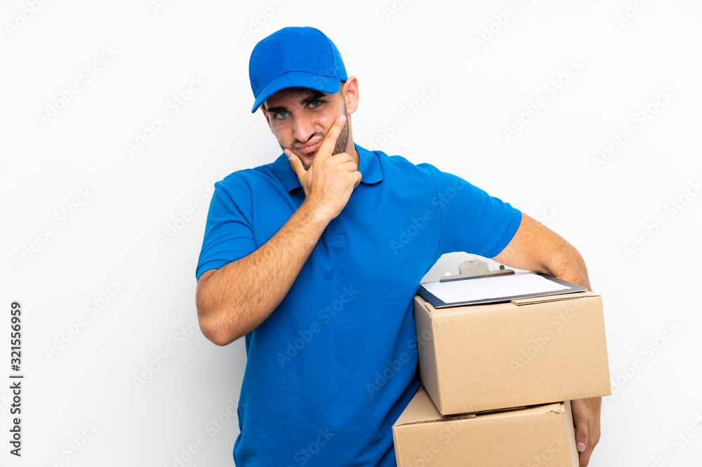 Delivery man over isolated white background thinking an idea Delivery man over isolated white background thinking an idea