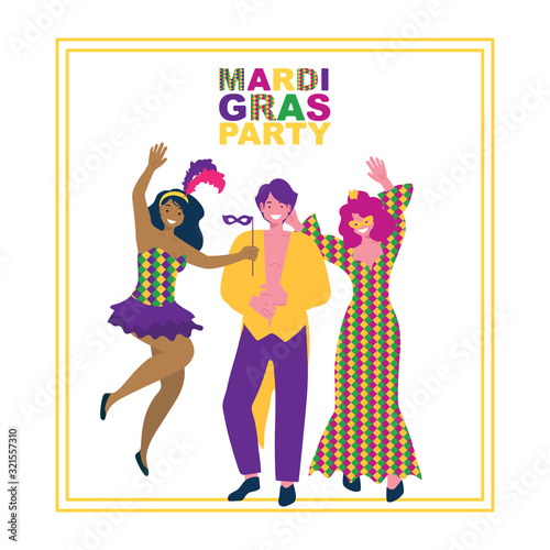 A man and two girls in masquerade costumes at the Mardi gras festival.