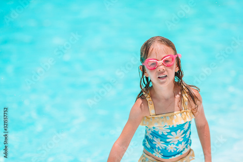 Little adorable girl in outdoor swimming pool © travnikovstudio
