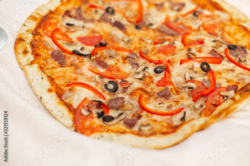 Tasty pizza with tomatoes and olives a
