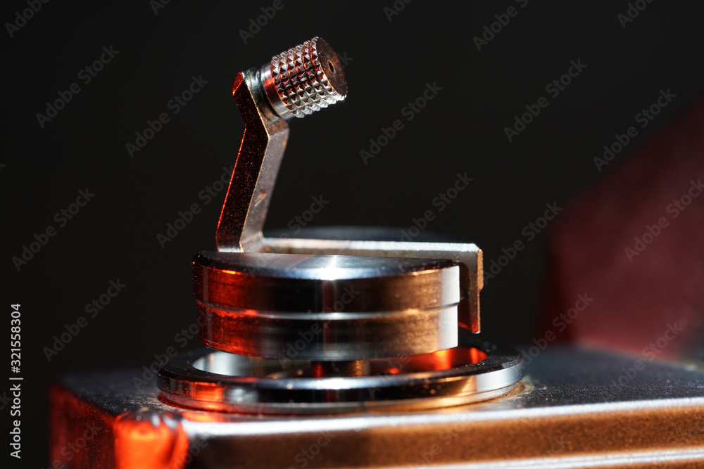 Small crank for film transport photographed on an old camera in the studio Small crank for film transport photographed on an old camera in the studio