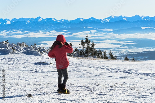 girl on top of the mountain photo