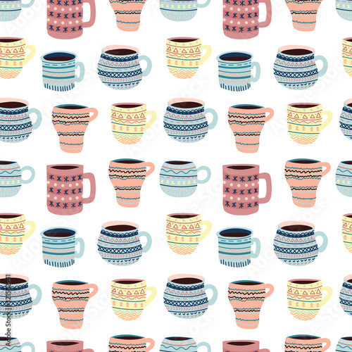 Seamless pattern with cute vector mugs with patterns for coffee and tea.
