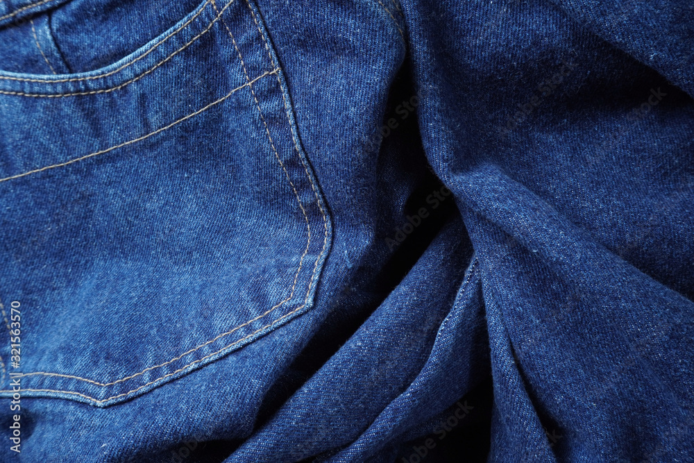 Jeans background. Denim jeans texture. Blue denim pattern.