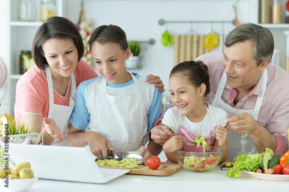 Portrait of family cooking together in kitchen Portrait of family cooking together in kitchen