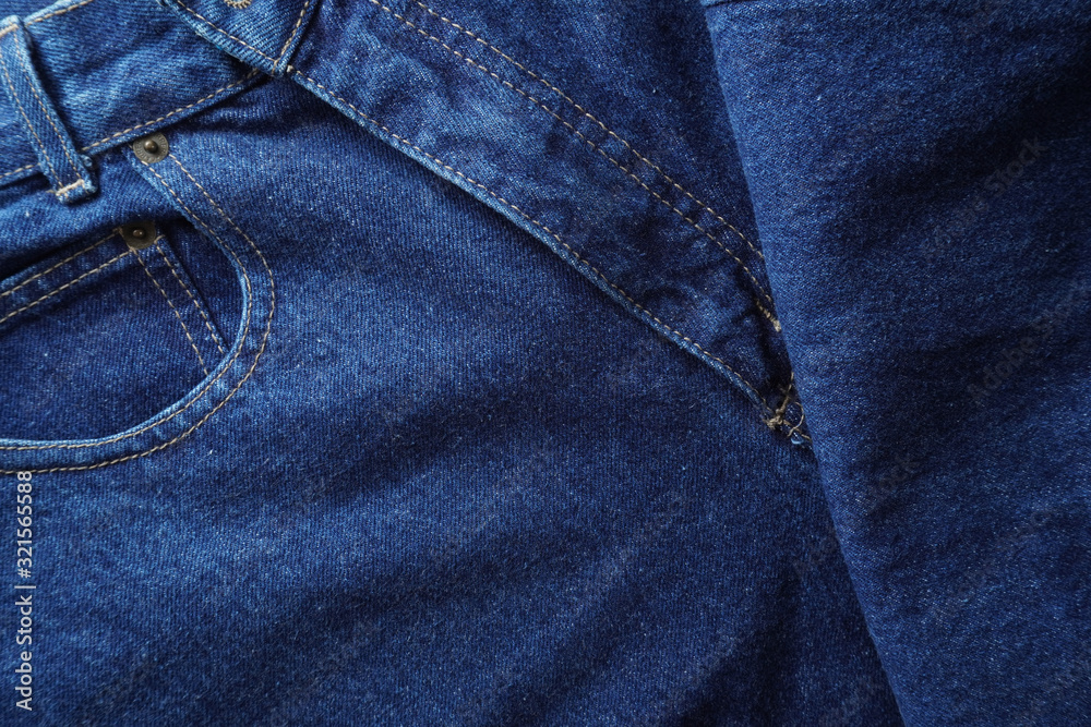 Jeans background. Denim jeans texture. Blue denim pattern.