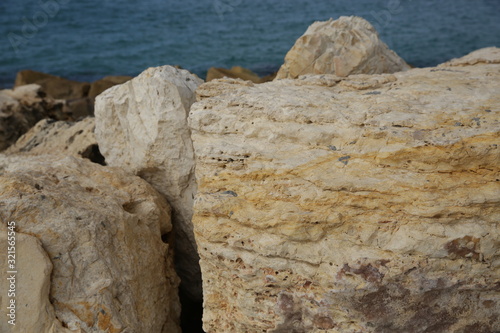color structure of natural stone on the sea beach. texture background pattern