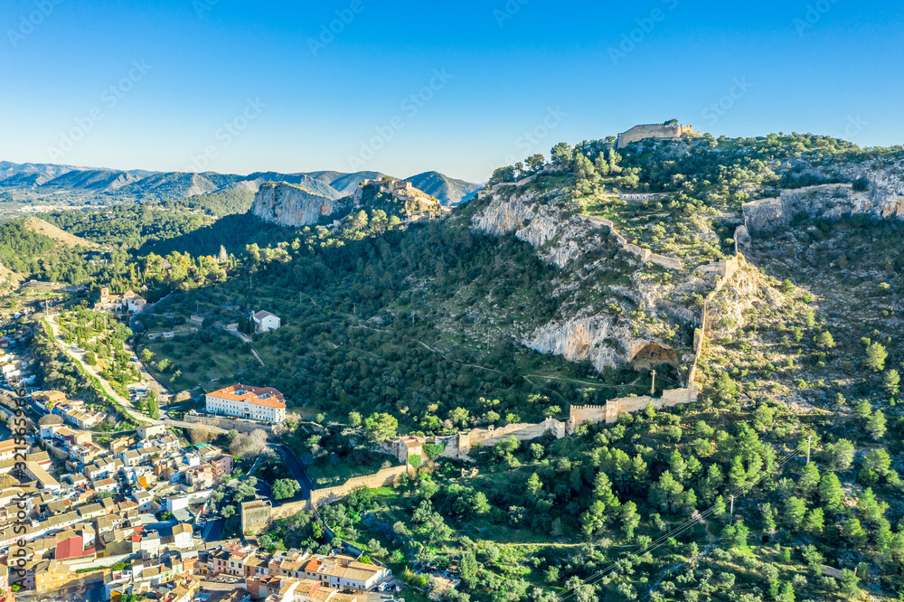 Aerial view of Xativa castle located near Valencia Spain on the ancient roadway  Via Augusta leading from Rome to Cartagena. Two forts connected by walls and curtains running down surrounding the city