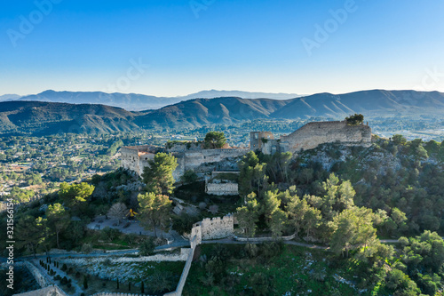 Aerial view of Xativa castle located near Valencia Spain on the ancient roadway  Via Augusta leading from Rome to Cartagena. Two forts connected by walls and curtains running down surrounding the city photo