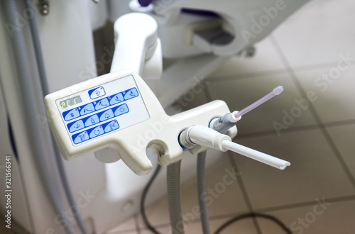 Dental saliva ejector. Dental equipment in the dental office. dentist day photo