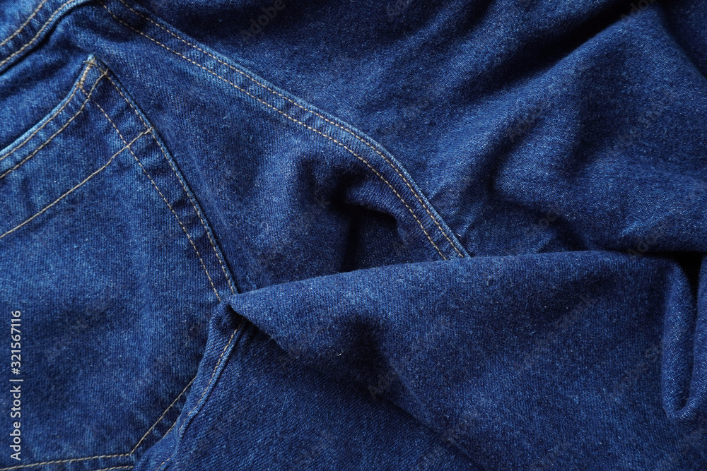 Naklejka premium Jeans background. Denim jeans texture. Blue denim pattern.