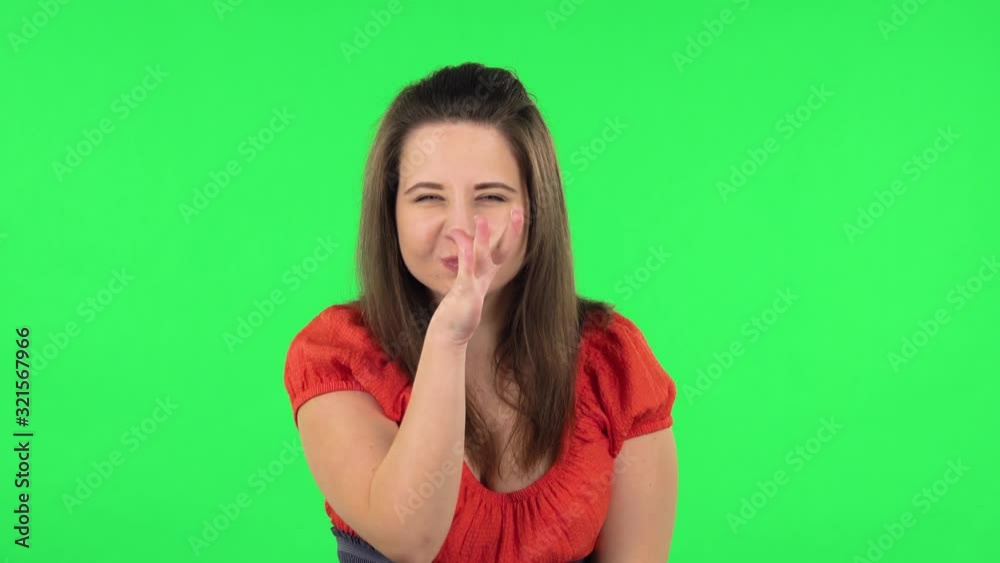 Portrait of cute girl posing for camera and making funny faces. Green screen Portrait of cute girl posing for camera and making funny faces. Green screen