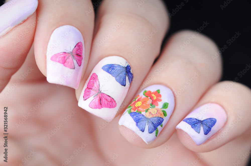 blue pink color manicure with butterfly pattern blue pink color manicure with butterfly pattern