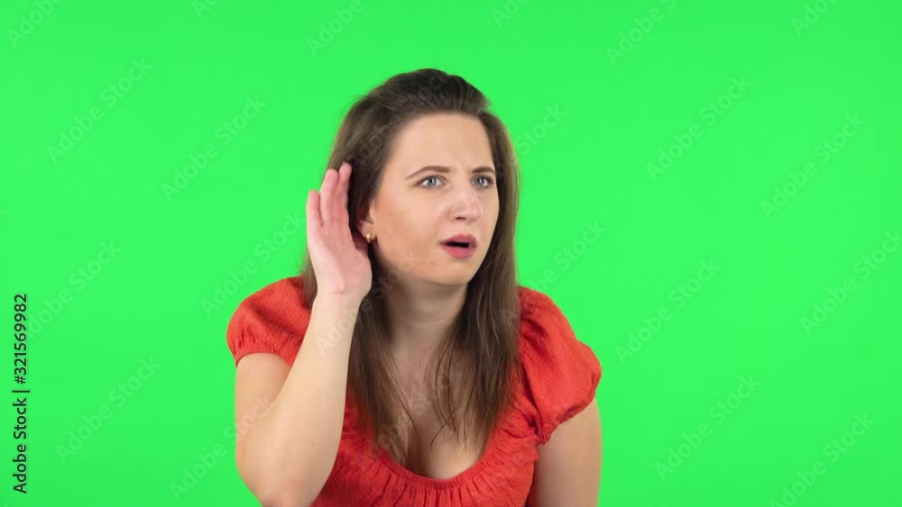 Portrait of girl holding hand near ear trying listen to interesting news expressing communication concept . Greenscreen Portrait of girl holding hand near ear trying listen to interesting news expressing communication concept . Greenscreen