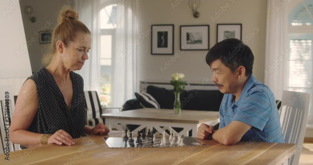 LS Senior Couple Playing Chess. Shot in R3D (6K RED RAW) LS Senior Couple Playing Chess. Shot in R3D (6K RED RAW)