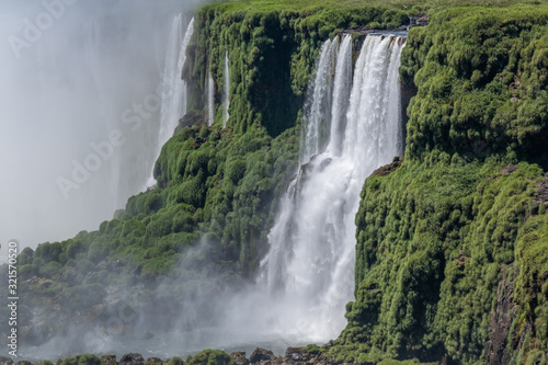 The awe inspiring Iguazu Falls  Igua  u   waterfalls of the Iguazu River on the border between Argentina and Brazil. The largest waterfall in the world