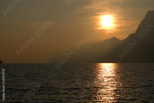 sunset over the sea,sun, sky, water,cloud, evening, coast, mountain,landscape,light, beautiful, reflection, 