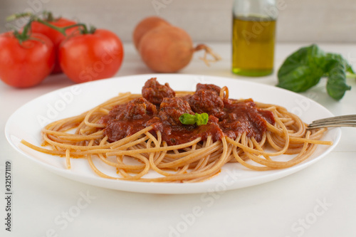 Whole grain spaghetti with complex carbohydrates on a white background. Healthy food.
