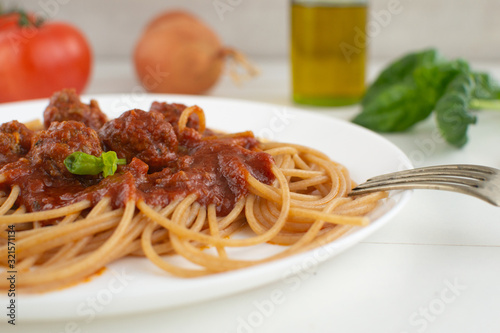 Whole grain spaghetti with complex carbohydrates on a white background. Healthy food.