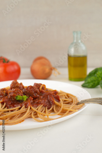 Whole grain spaghetti with complex carbohydrates on a white background. Healthy food.