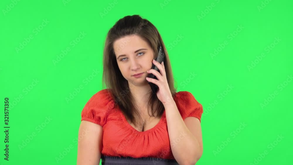 Portrait of cute girl talking for mobile phone. Green screen Portrait of cute girl talking for mobile phone. Green screen