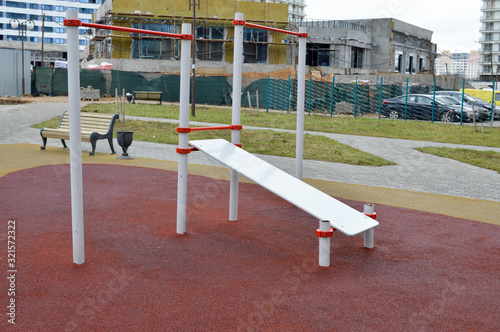 A new, modern, outdoor outdoor workout area with exercise machine for the press in a new area of the city in the courtyard of the new building