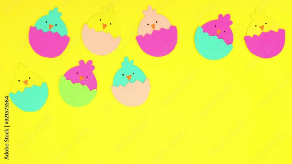 Easter chickens in egg appear on yellow background - Stop motion Easter chickens in egg appear on yellow background - Stop motion