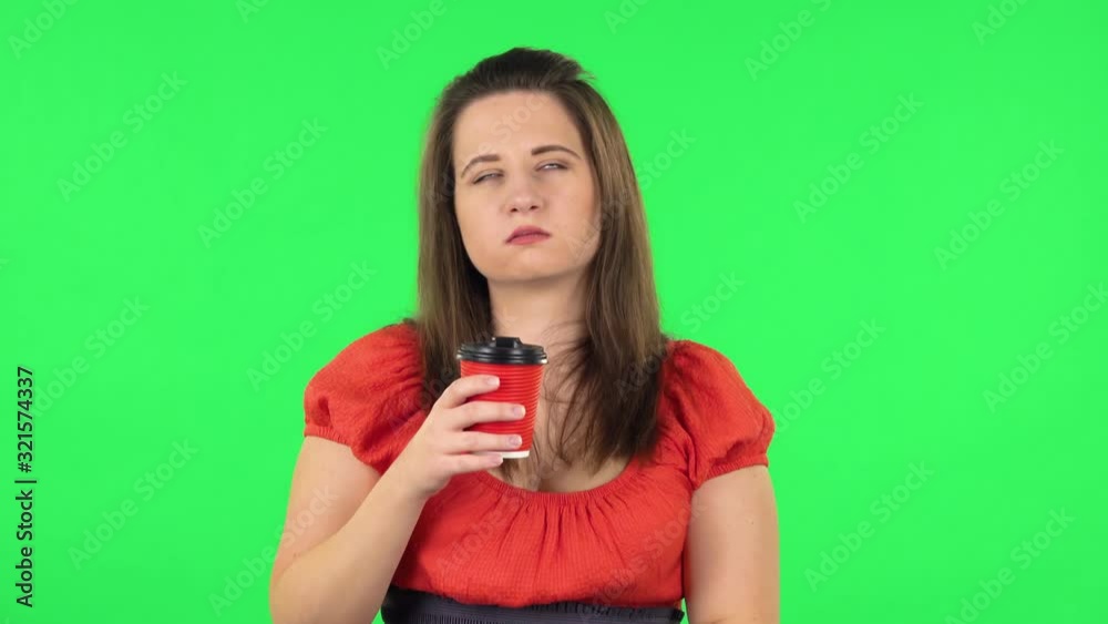 Portrait of cute girl is drinking coffee and then enjoying. Green screen Portrait of cute girl is drinking coffee and then enjoying. Green screen