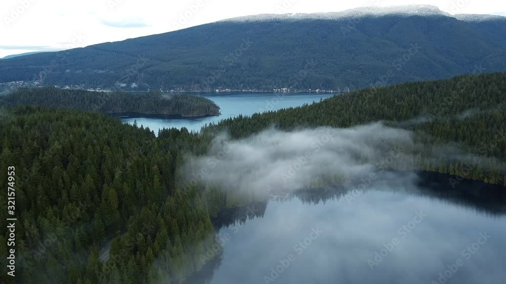 Fly over the cloud towards the green forest mountains and crystal clear river Fly over the cloud towards the green forest mountains and crystal clear river