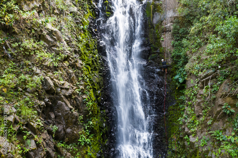 rappelling down a waterfall rappelling down a waterfall