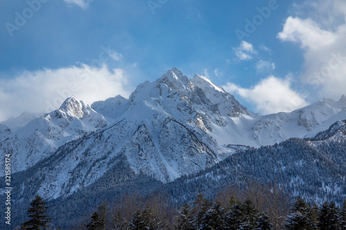 Overcast in mountains. Beautiful mountain rocks in clouds. Landscape of the North Caucasus