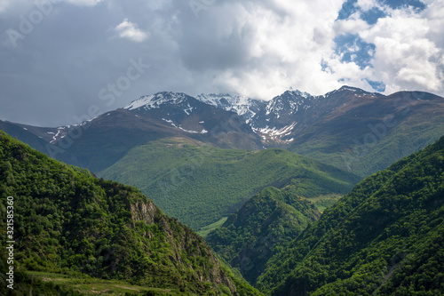 Fototapeta Naklejka Na Ścianę i Meble -  Overcast in mountains. Beautiful mountain rocks in clouds. Landscape of the North Caucasus