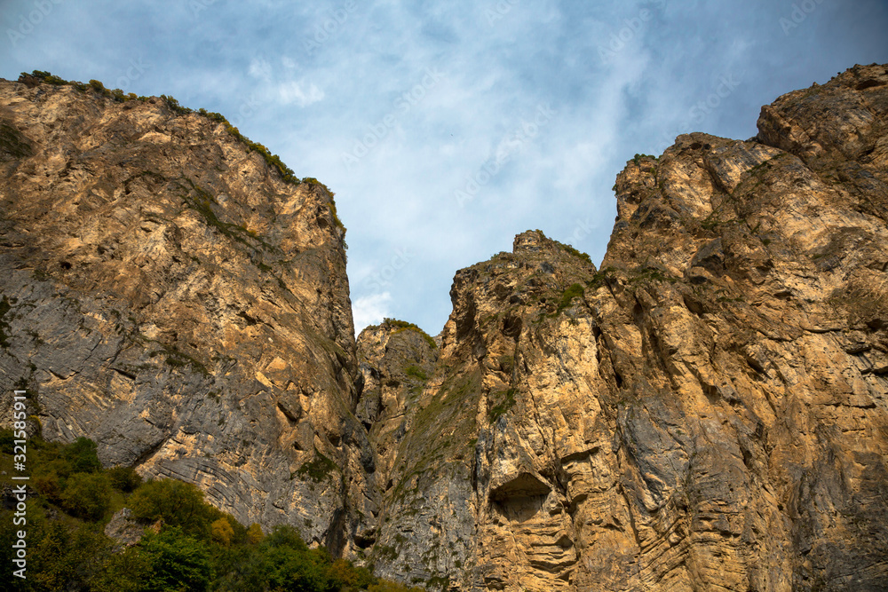 Mountain rocks. The beautiful gorge with high rocks. Nature of the North Caucasus Mountain rocks. The beautiful gorge with high rocks. Nature of the North Caucasus