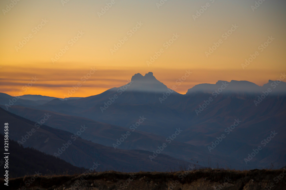 Decline in mountains. The evening sky over rocks. Landscape of the North Caucasus Decline in mountains. The evening sky over rocks. Landscape of the North Caucasus