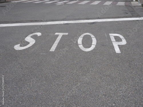 stop sign on tarmac © Claudio Divizia