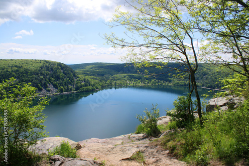 Beautiful Wisconsin late spring nature background. Areal view on the lake from West Bluff rocky ice age hiking trail. Devil's Lake State Park, Baraboo area, Wisconsin, Midwest USA. © Maryna