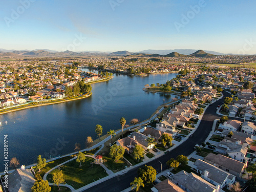 Aerial view of Menifee Lake and neighborhood, residential subdivision vila during sunset. Riverside County, California, United States