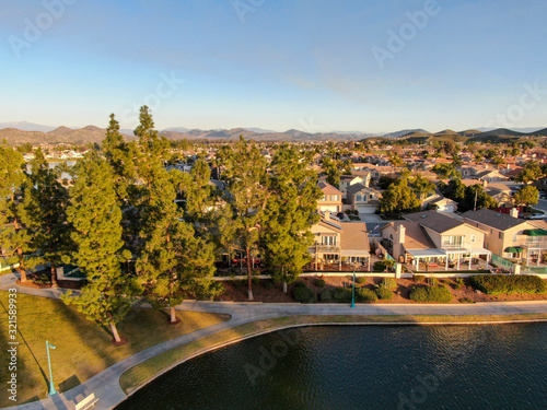 Aerial view of Menifee Lake and neighborhood  residential subdivision vila during sunset. Riverside County  California  United States