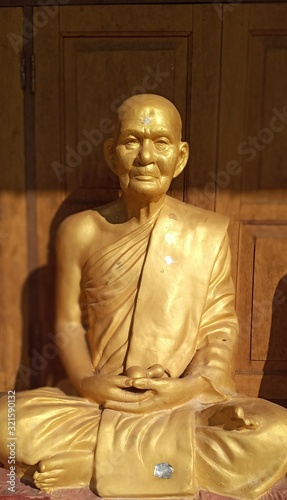 Golden statue of the holy Buddhist monk Louang Po Shop, northern Thailand
