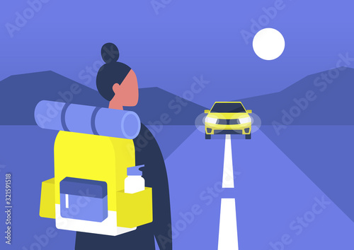 Young female backpacker waiting a car to approach, hitchhiking, road trip adventures